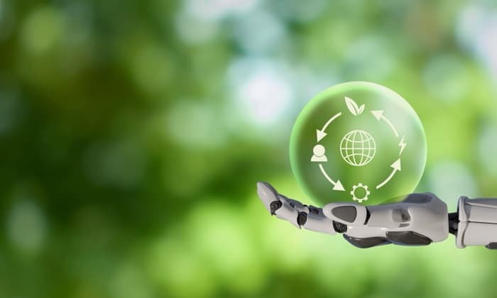 A hand holding a glowing globe with a leaf