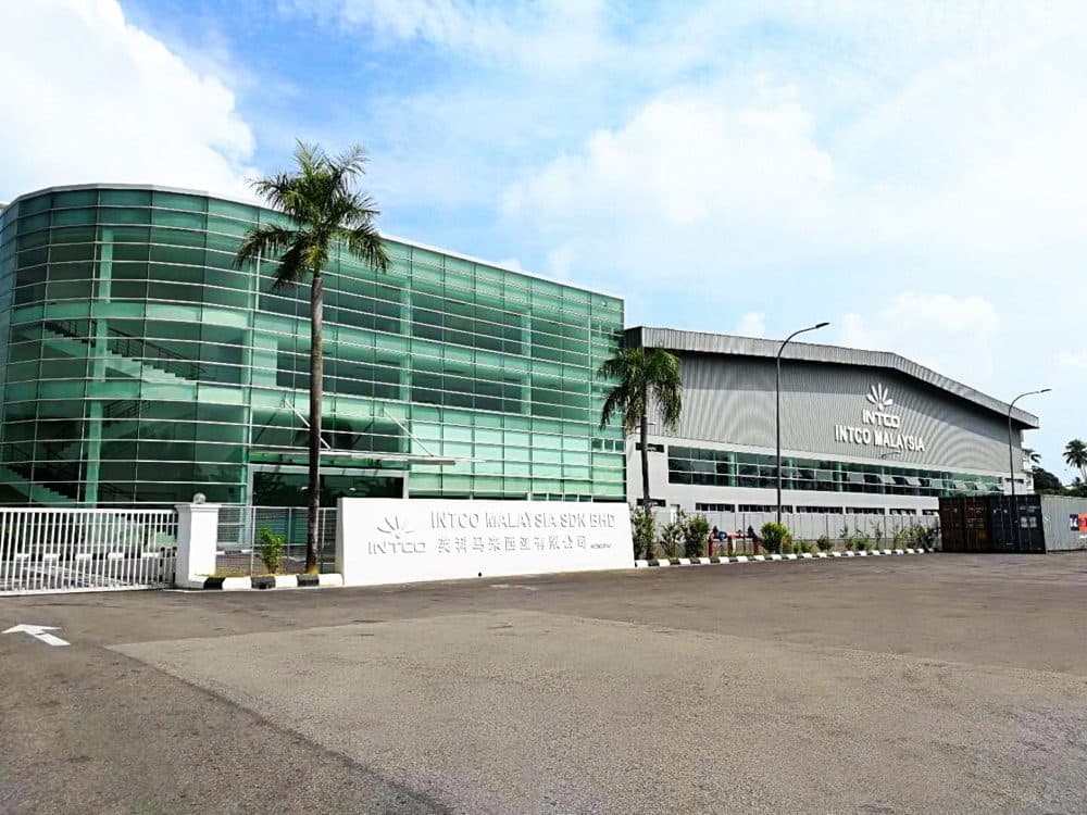 INTCO Malaysia recycling factory exterior with palm trees